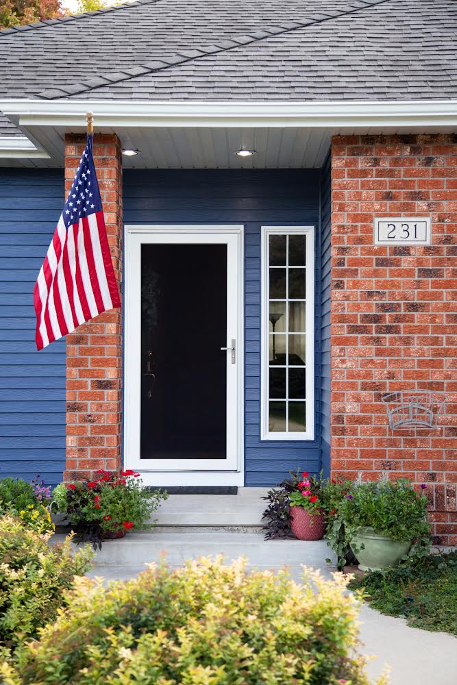 House With Flag Storm Door with American Flag on the porch