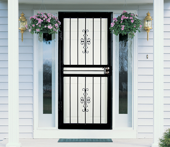 black-security-storm-door-decorative-scrollwork Black steel security storm door with vertical bars and decorative scrollwork on a white home entryway